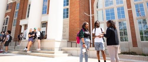 Students talking on campus between classes